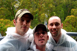 Chris, Chris, and me in plastic ponchos at the Otway Fly Treetop Walk