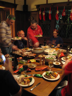 Petey, Brad, Elana, and Phil at their end of the Christmas dinner table