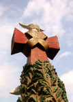 Cross and dove at the top of the Nativity Facade